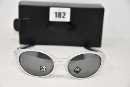 A boxed as new Oakley Eyejacket Redux Silver frame with prizm black polarized lenses (