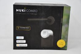 A boxed as new Nuki Combo smart lock 2.0 plus bridge.