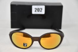 A boxed as new pair of Oakley Eyejacket Redux sunglasses corten frame with Prizm 24k Polarized