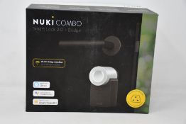 A boxed as new Nuki Combo smart lock 2.0 plus bridge.