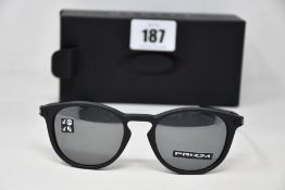 A boxed as new pair of Oakley Pitchman R glasses Satin Black frame with Prizm Black Polarized lenses