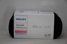 Four as new Philips Zoom DayWhite teeth whitening kits.