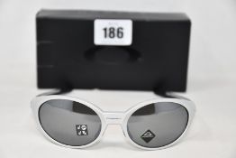 A boxed as new Oakley Eyejacket Redux Silver frame with prizm black polarized lenses (