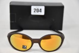 A boxed as new pair of Oakley Eyejacket Redux sunglasses corten frame with Prizm 24k Polarized