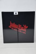 An as new Judas Priest 50 Heavy Metal Years collectors book.