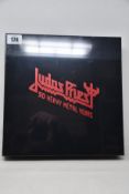 A sealed Judas Priest 50 Heavy Metal Years collectors book.