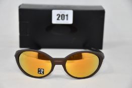A boxed as new pair of Oakley Eyejacket Redux sunglasses corten frame with Prizm 24k Polarized