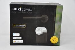 A boxed as new Nuki Combo smart lock 2.0 plus bridge.