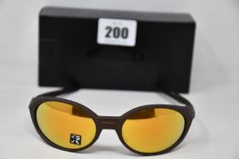 A boxed as new pair of Oakley Eyejacket Redux sunglasses corten frame with Prizm 24k Polarized
