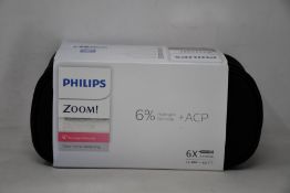 Four as new Philips Zoom DayWhite teeth whitening kits.