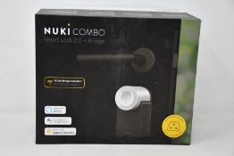 A boxed as new Nuki Combo smart lock 2.0 plus bridge.