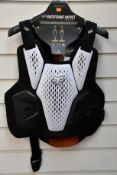 An as new Fox Raceframe Impact SB CE D30 Protector Vest in black/White (L/XL).