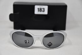 A boxed as new Oakley Eyejacket Redux Silver frame with prizm black polarized lenses (