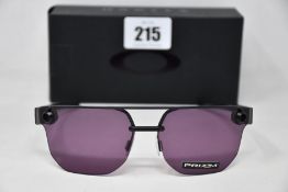 Two boxed as new Oakley Chrystl matte black frame with prizm indigo lenses (888392427021).