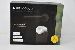 A boxed as new Nuki Combo smart lock 2.0 plus bridge.