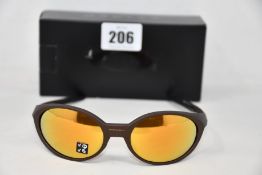 A boxed as new pair of Oakley Eyejacket Redux sunglasses corten frame with Prizm 24k Polarized