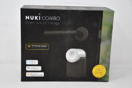 A boxed as new Nuki Combo smart lock 2.0 plus bridge.