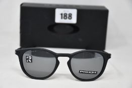 A boxed as new pair of Oakley Pitchman R glasses Satin Black frame with Prizm Black Polarized lenses