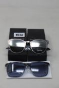 Two pairs of men's as new Police sunglasses.
