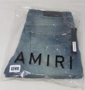 A pair of as new Amiri MX1 leather patch jeans (Size 36).