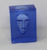 Two Kosta Boda Azure Man glass block sculptures.