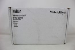 A boxed as new Welch Allyn Braun ThermoScan PRO 6000 ear thermometer with cradle.