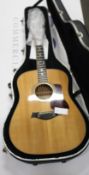 A pre-owned Taylor 410 Dreadnought Acoustic Guitar with hard case.
