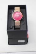 A women's as new Coluri Pankhurst watch in scarlet (RRP £139).