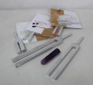 A quantity of Biosonics Sound Healing forks and an Amethyst wand.