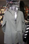 An as new Stutterheim Mosebacke coat in khaki green (M).
