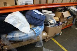 A shelf containing miscellaneous items to include household items, souvenirs and toys.