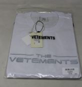 An as new unisex Vetements The Logo T-shirt in white (XL).