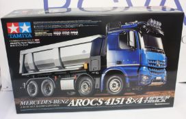 A boxed as new Tamiya Mercedes-Benz Arocs 4151 8x4 tipper truck radio controlled model kit.