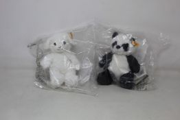 A quantity of as new Steiff Soft Cuddly Friends - Ming Panda and Fuzzy Lamb (Approximately 25).