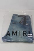 A pair of as new Amiri MX1 leather patch jeans (Size 32).