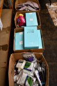 Three boxes of assorted as new toiletries and beauty products.