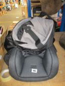 A Babyzen Yoyo bag and an Urban Kanga TV107 portable travel seat.