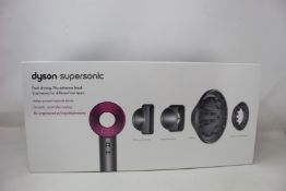 A boxed as new Dyson Supersonic hairdryer.