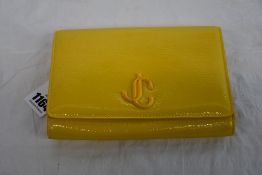 An as new Jimmy Choo Varenne clutch in yellow (No tags but item is as new - RRP £695).