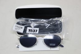 A pair of as new Calvin Klein sunglasses.