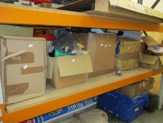 A shelf of miscellaneous items including beard trimmers, snoods and soft toys.