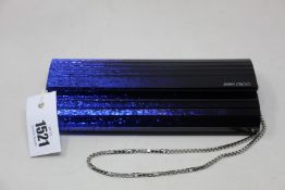 An as new Jimmy Choo Sweetie acrylic clutch in glitter blue (No tags but item is as new - RRP £