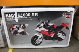 A child's boxed BMW S1000RR battery powered motorcycle.