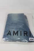A pair of as new Amiri MX1 leather patch jeans (Size 34).