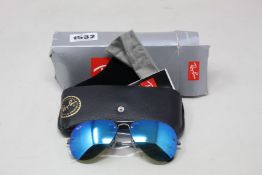 A pair of as new Ray Ban sunglasses.