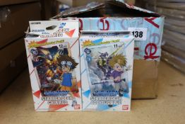 Twelve Digimon card game Starter decks (5x Gaia Red, 5x Cocytus Blue and 5x Heaven's Yellow).
