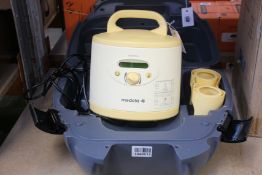 A Medela Symphony double electric breast pump (Unit and case only).