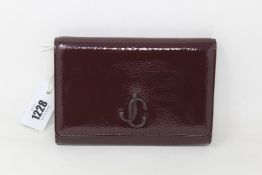 An as new Jimmy Choo Varenne clutch in merlot (No tags but item is as new - RRP £695).