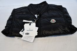 An as new Moncler Gui gilet (TG 3 - RRP £500).