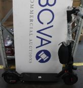 An unbranded electric scooter, unboxed with charger (As new condition).